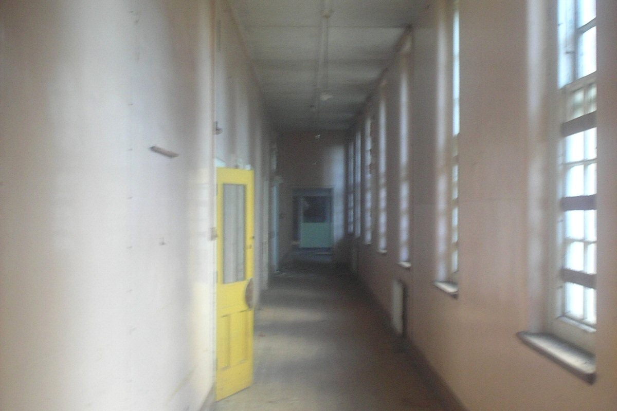 Abandoned hospital corridor used for an urbex gear checklist